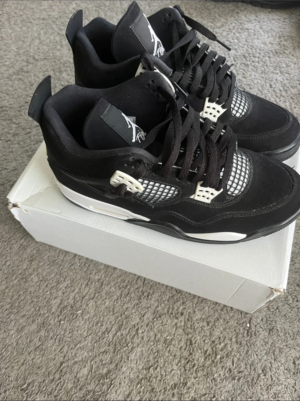 AIR JORDAN 4 RETRO Men’s Black and White Sneaker